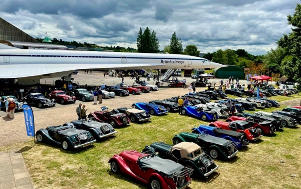 A group of cars parked in a field